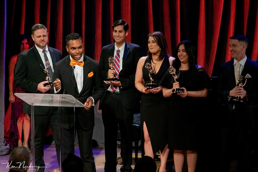 Antonio Ayala accepts EMMY onstage at awards ceremony
